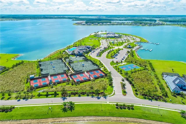 view of swimming pool with a lake view