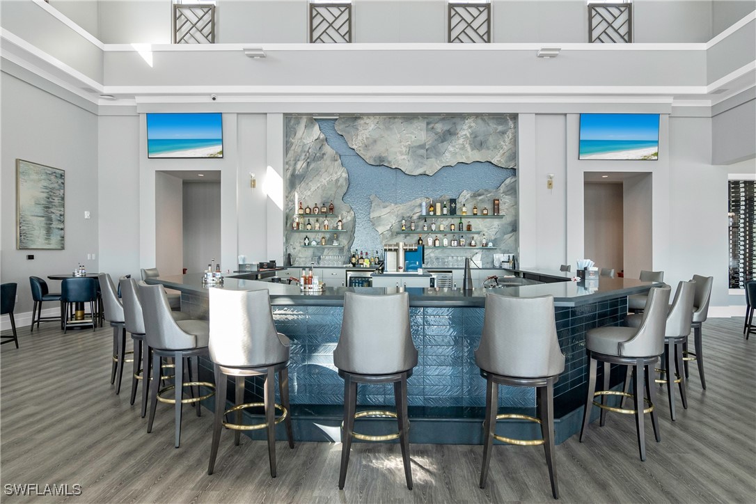 18837 WildBlue Boulevard Fort Myers, FL 33913 - Photo 42 of 49 a view of a dining room with furniture window and wooden floor