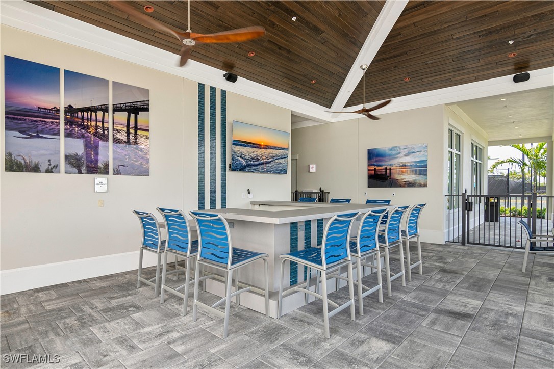 18837 WildBlue Boulevard Fort Myers, FL 33913 - Photo 47 of 49 a view of a dining room with furniture