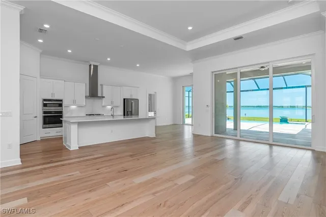 a view of kitchen with cabinets and wooden floor
