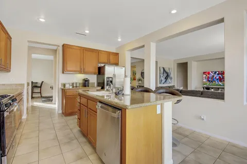 a kitchen with stainless steel appliances granite countertop a sink and cabinets