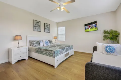 a bedroom with a bed and a couch