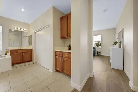 a bathroom with a sink a toilet a mirror and shower