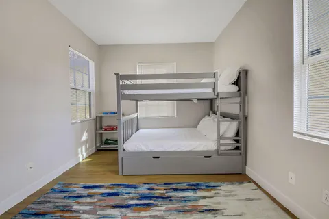 a bedroom with a bed and window