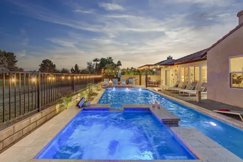 a view of swimming pool with outdoor seating