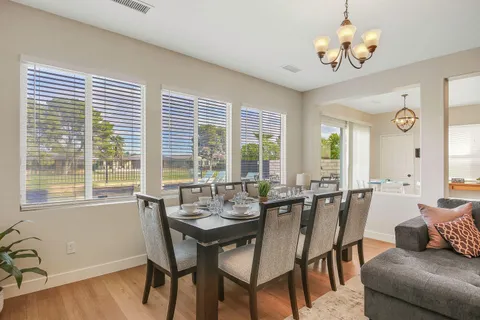 a view of a dining room with furniture window and outside view