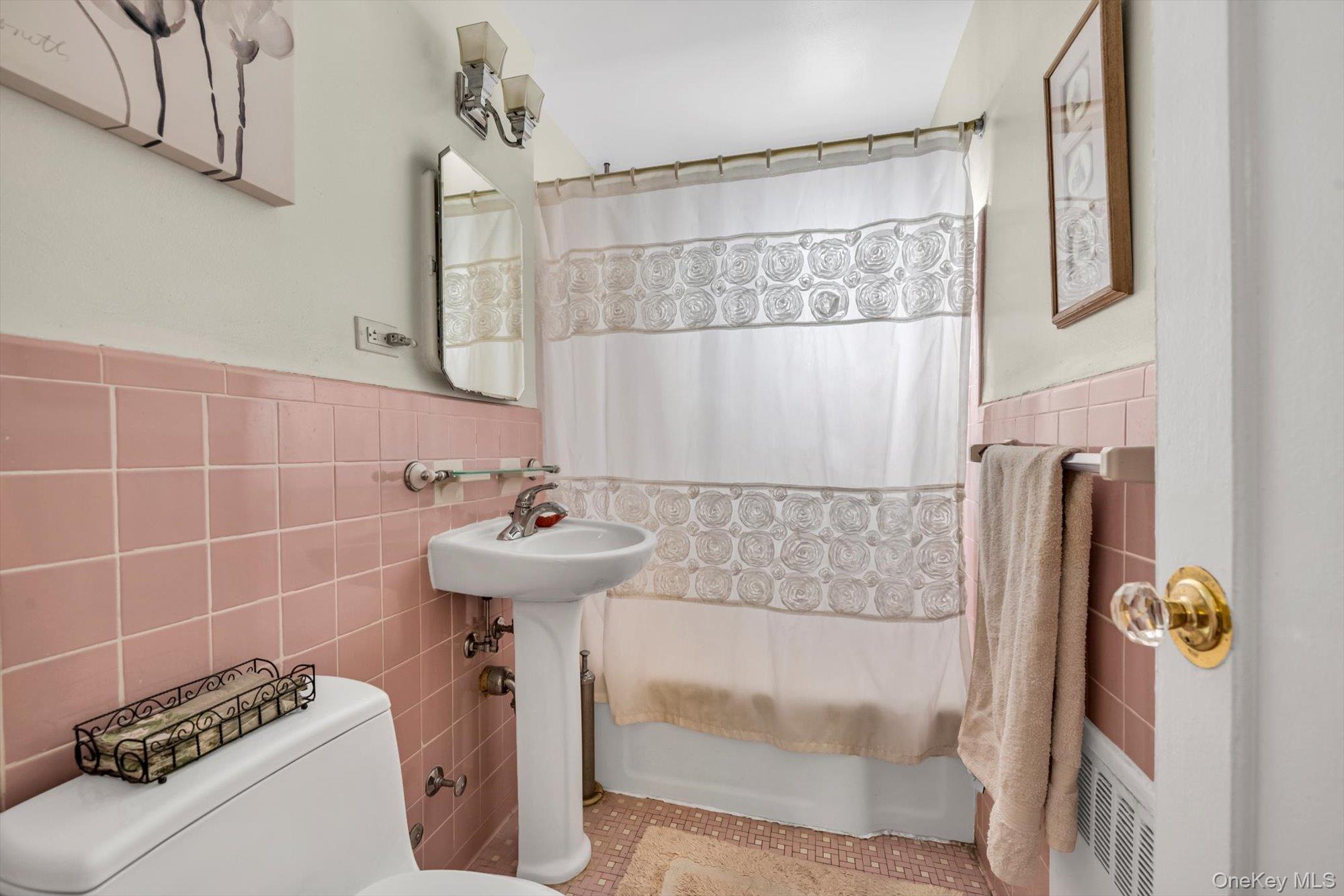 69-18 Bell Boulevard, Unit B Queens, NY 11364 - Photo 8 of 9 a bathroom with a sink a toilet and shower