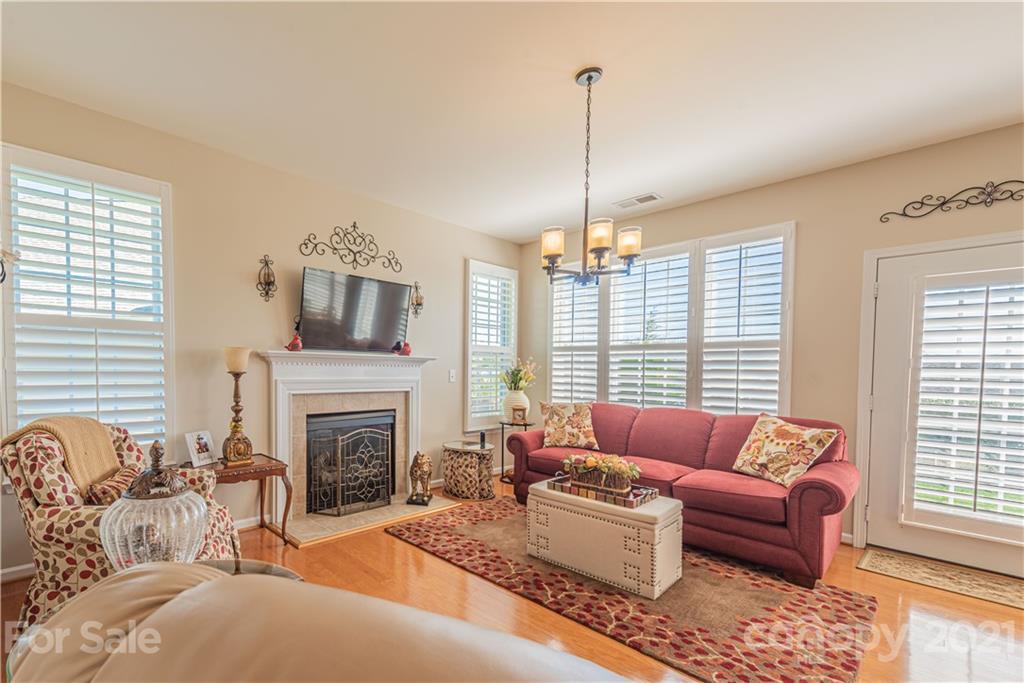 279 Garnet Court, Unit 549 Fort Mill, SC 29708 - Photo 19 of 47 a living room with furniture large window and fireplace