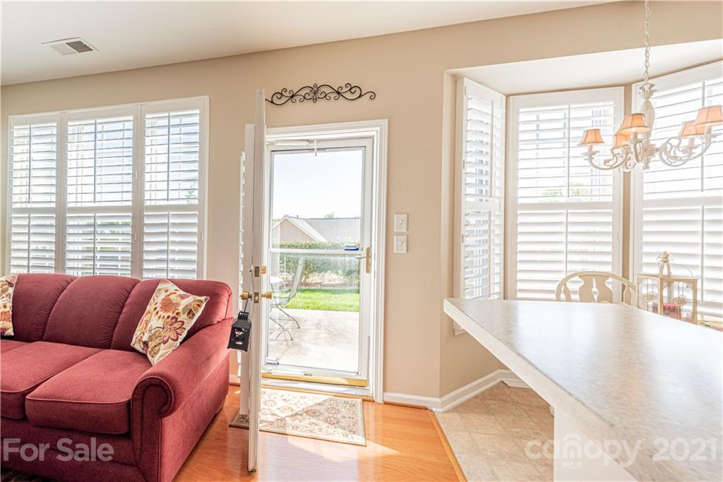 279 Garnet Court, Unit 549 Fort Mill, SC 29708 - Photo 20 of 47 a living room with furniture and a large window