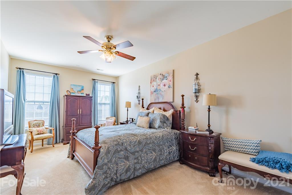 279 Garnet Court, Unit 549 Fort Mill, SC 29708 - Photo 21 of 47 a bedroom with a bed and furniture