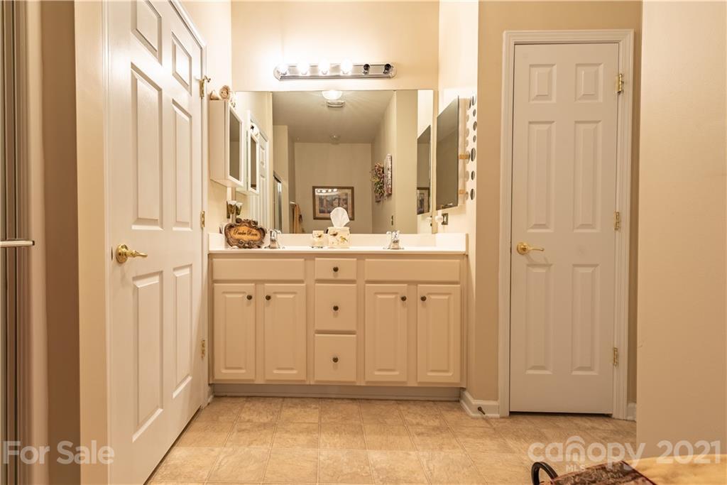 279 Garnet Court, Unit 549 Fort Mill, SC 29708 - Photo 29 of 47 a bathroom with a sink and a mirror