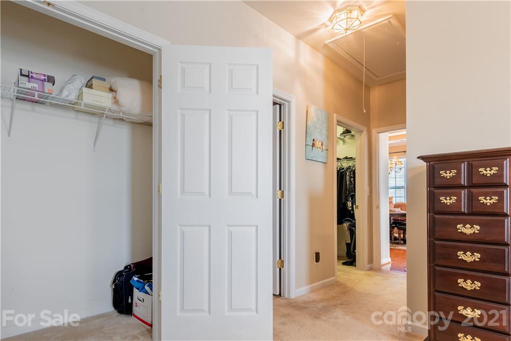 279 Garnet Court, Unit 549 Fort Mill, SC 29708 - Photo 31 of 47 a view of walk in closet with clothes and shoes
