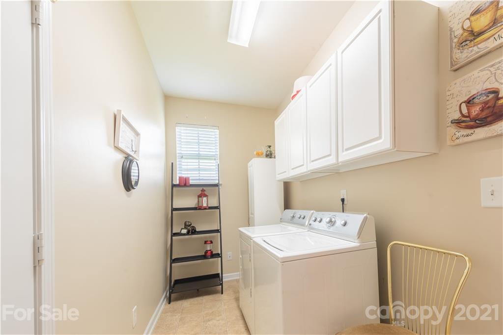 279 Garnet Court, Unit 549 Fort Mill, SC 29708 - Photo 32 of 47 a utility room with dryer and washer