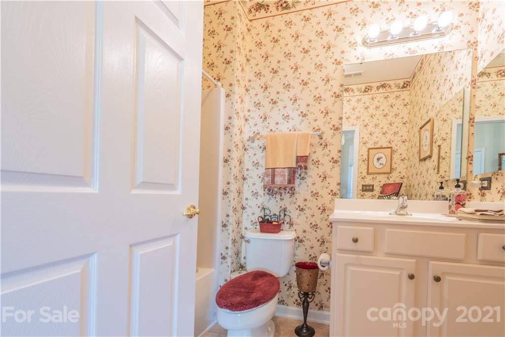 279 Garnet Court, Unit 549 Fort Mill, SC 29708 - Photo 34 of 47 a bathroom with a sink toilet vanity and shower