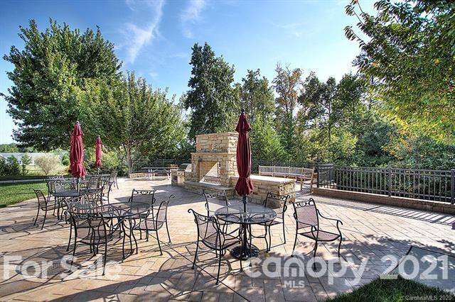 279 Garnet Court, Unit 549 Fort Mill, SC 29708 - Photo 40 of 47 a view of a chairs and tables in the patio