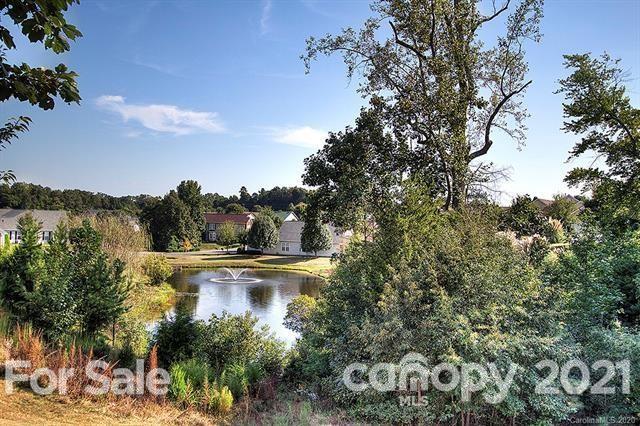 279 Garnet Court, Unit 549 Fort Mill, SC 29708 - Photo 46 of 47 a view of a lake with trees all around