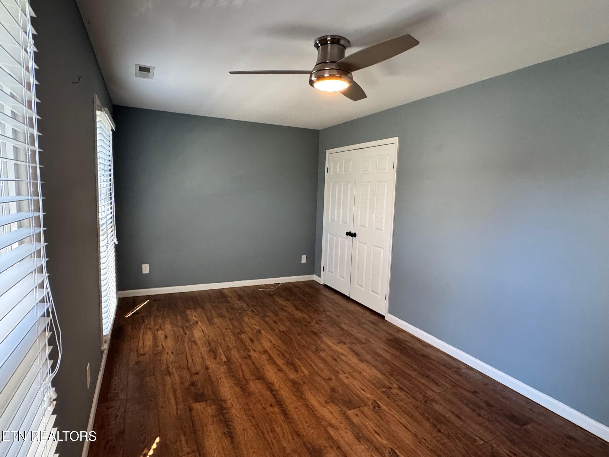 34 Hampton Square Crossville, TN 38555 - Photo 16 of 30 wooden floor in an empty room with a window