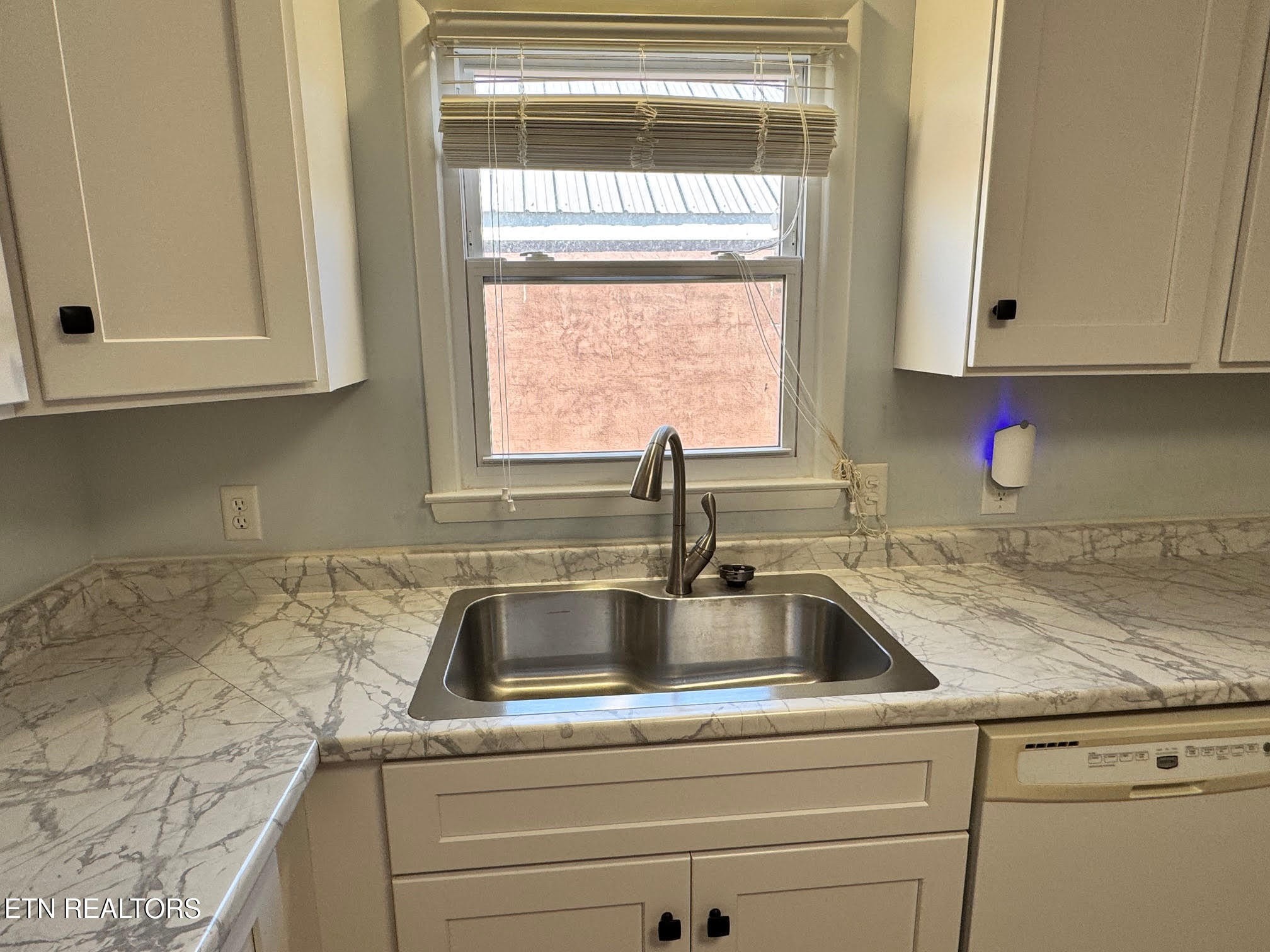 34 Hampton Square Crossville, TN 38555 - Photo 8 of 30 a kitchen with granite countertop a sink and cabinets