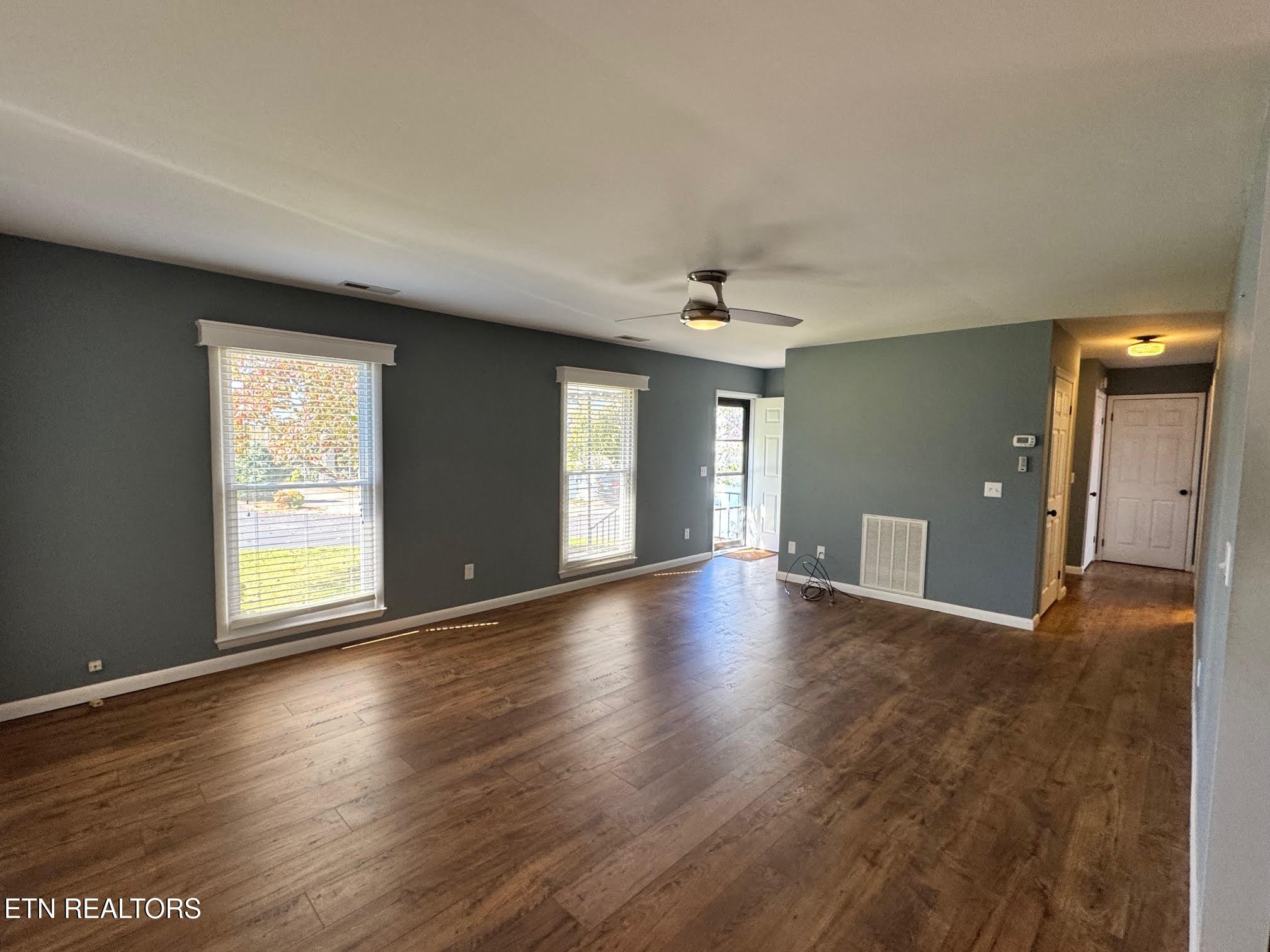 34 Hampton Square Crossville, TN 38555 - Photo 10 of 30 a view of an empty room with window and wooden floor