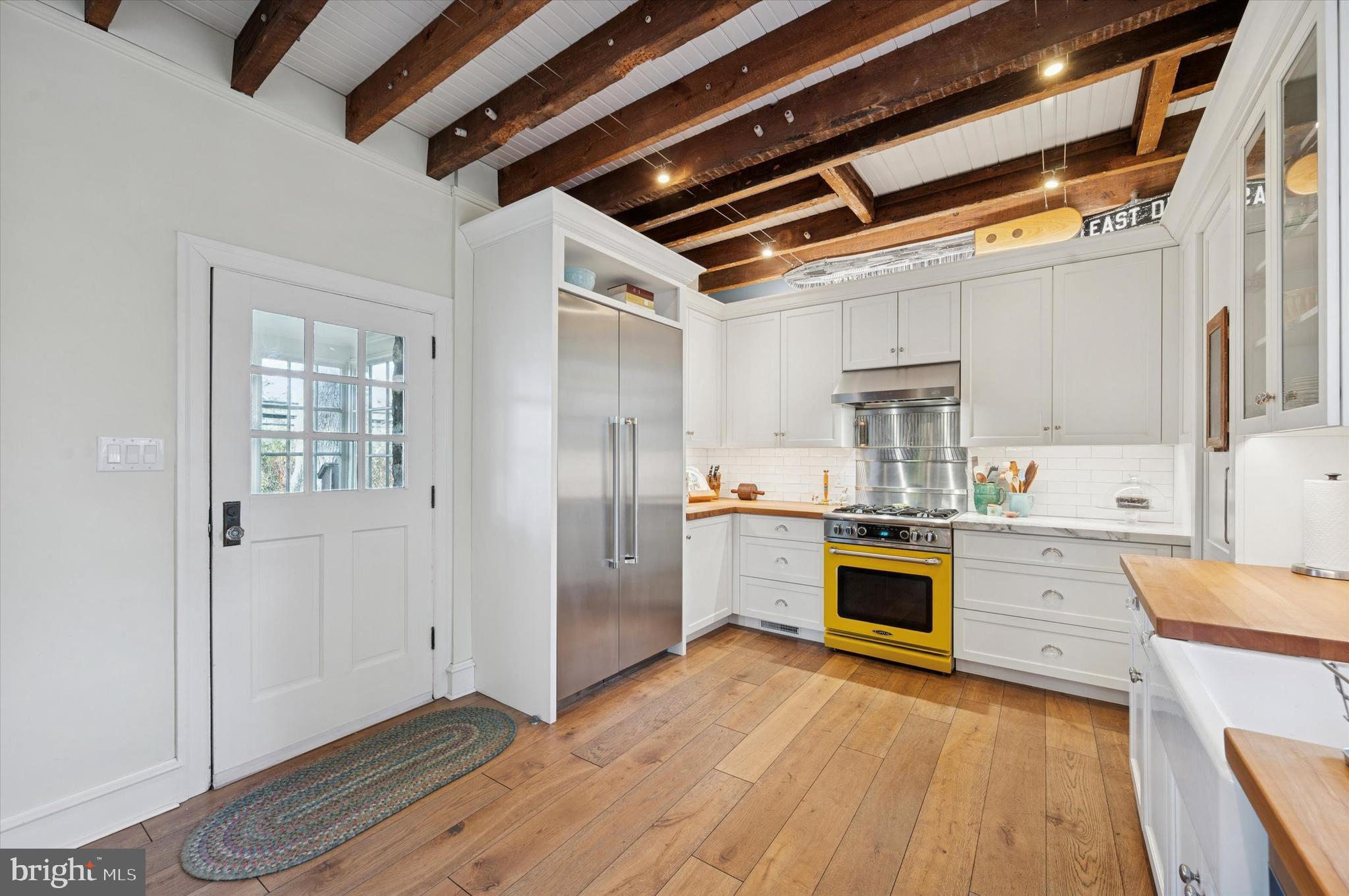 353 Woodley Road Merion Station, PA 19066 - Photo 11 of 20 a kitchen with stainless steel appliances granite countertop a refrigerator and a stove