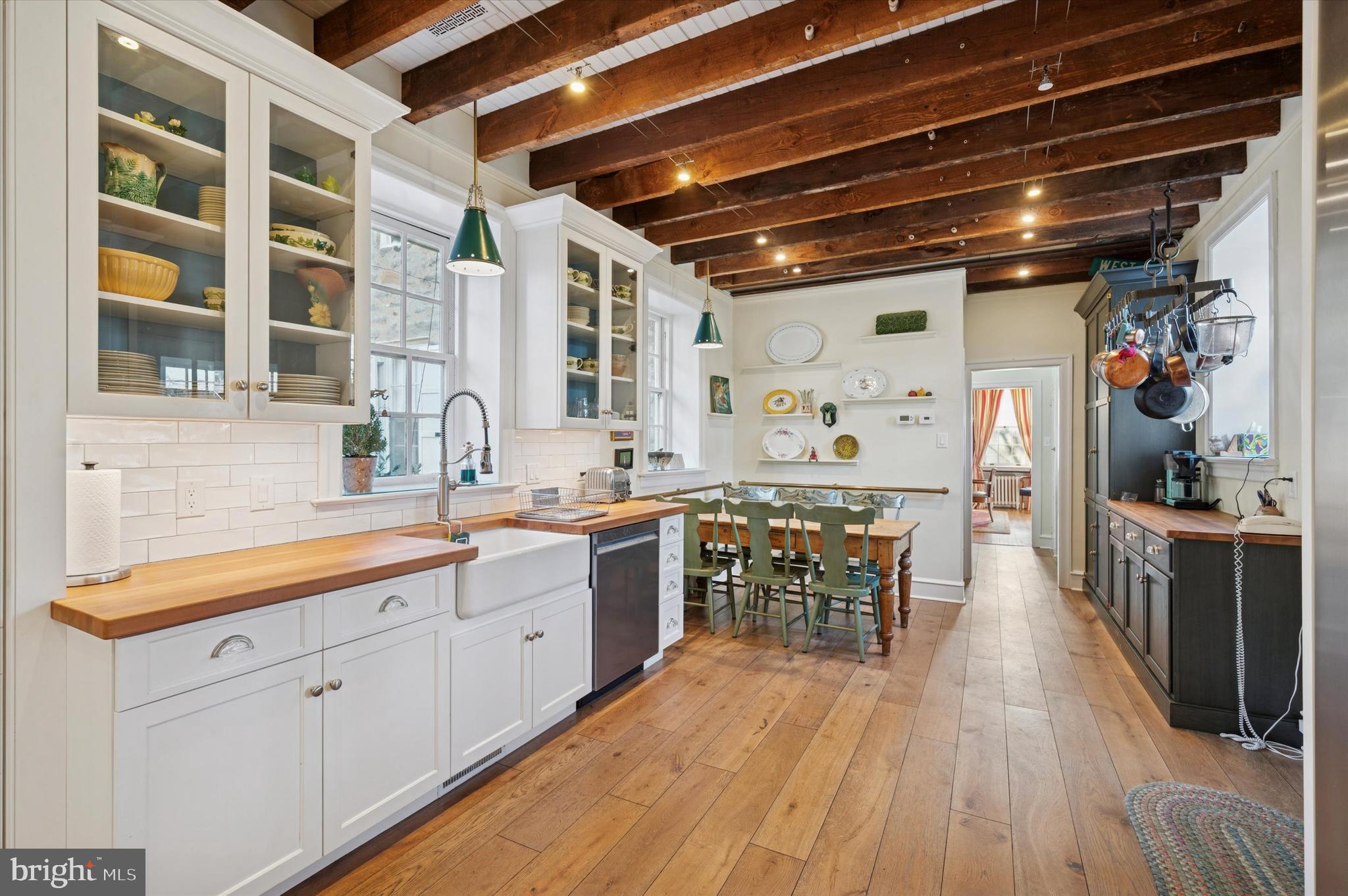 353 Woodley Road Merion Station, PA 19066 - Photo 14 of 20 a large kitchen with a lot of counter space and wooden floor