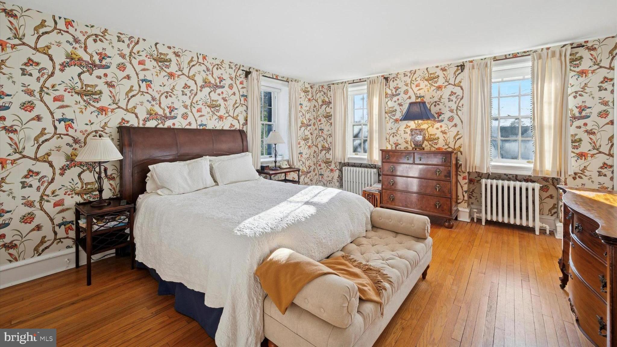 353 Woodley Road Merion Station, PA 19066 - Photo 16 of 20 a bedroom with a bed and wooden floor