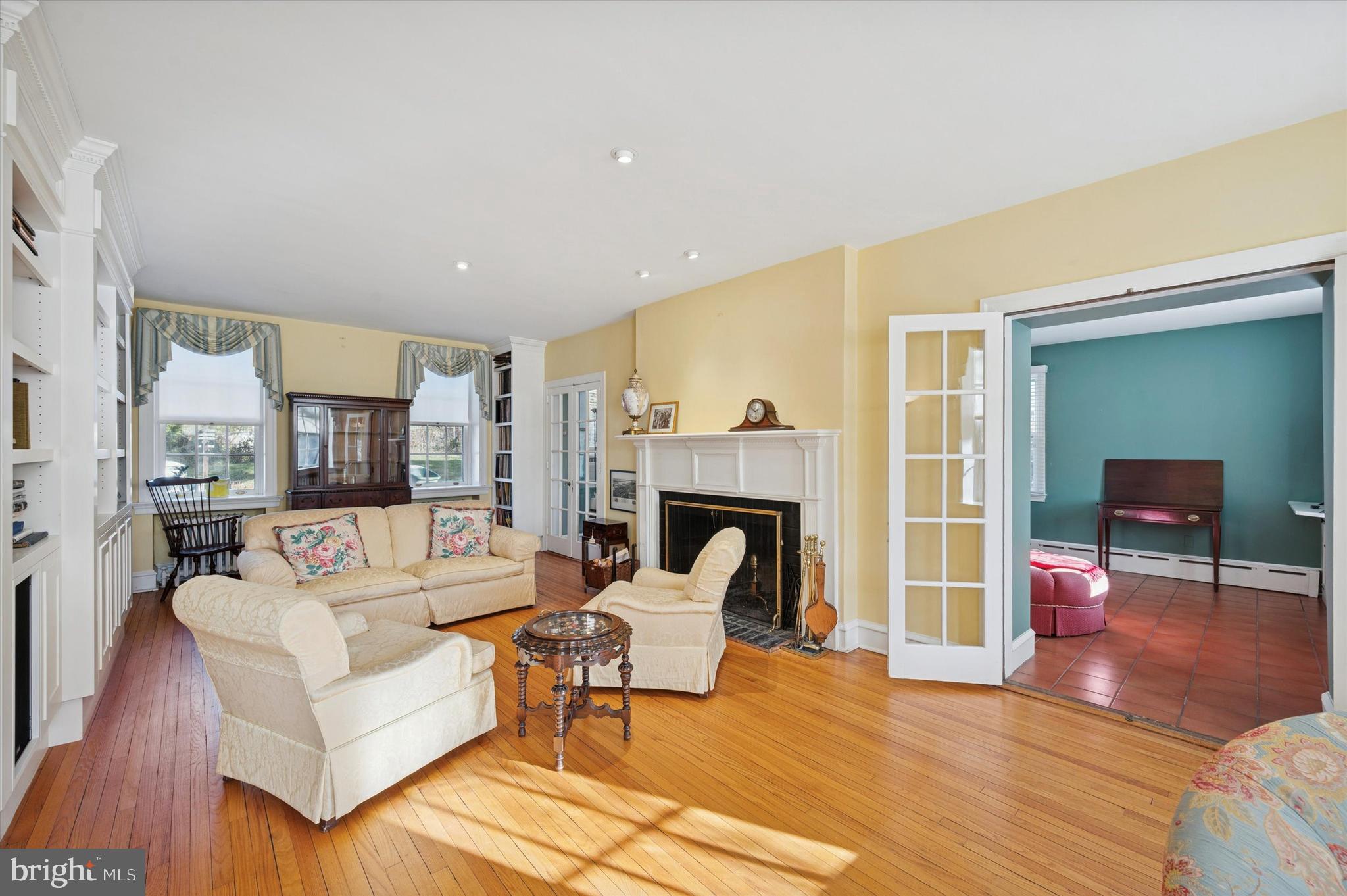 353 Woodley Road Merion Station, PA 19066 - Photo 5 of 20 a living room with furniture and a fireplace