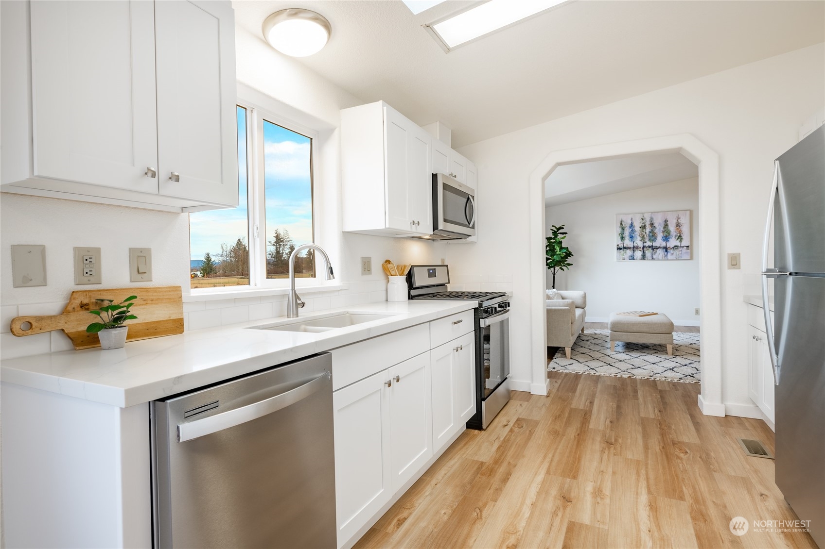 6671 Olson Road Ferndale, WA 98248 - Photo 14 of 40 a kitchen with a sink and a stove top oven