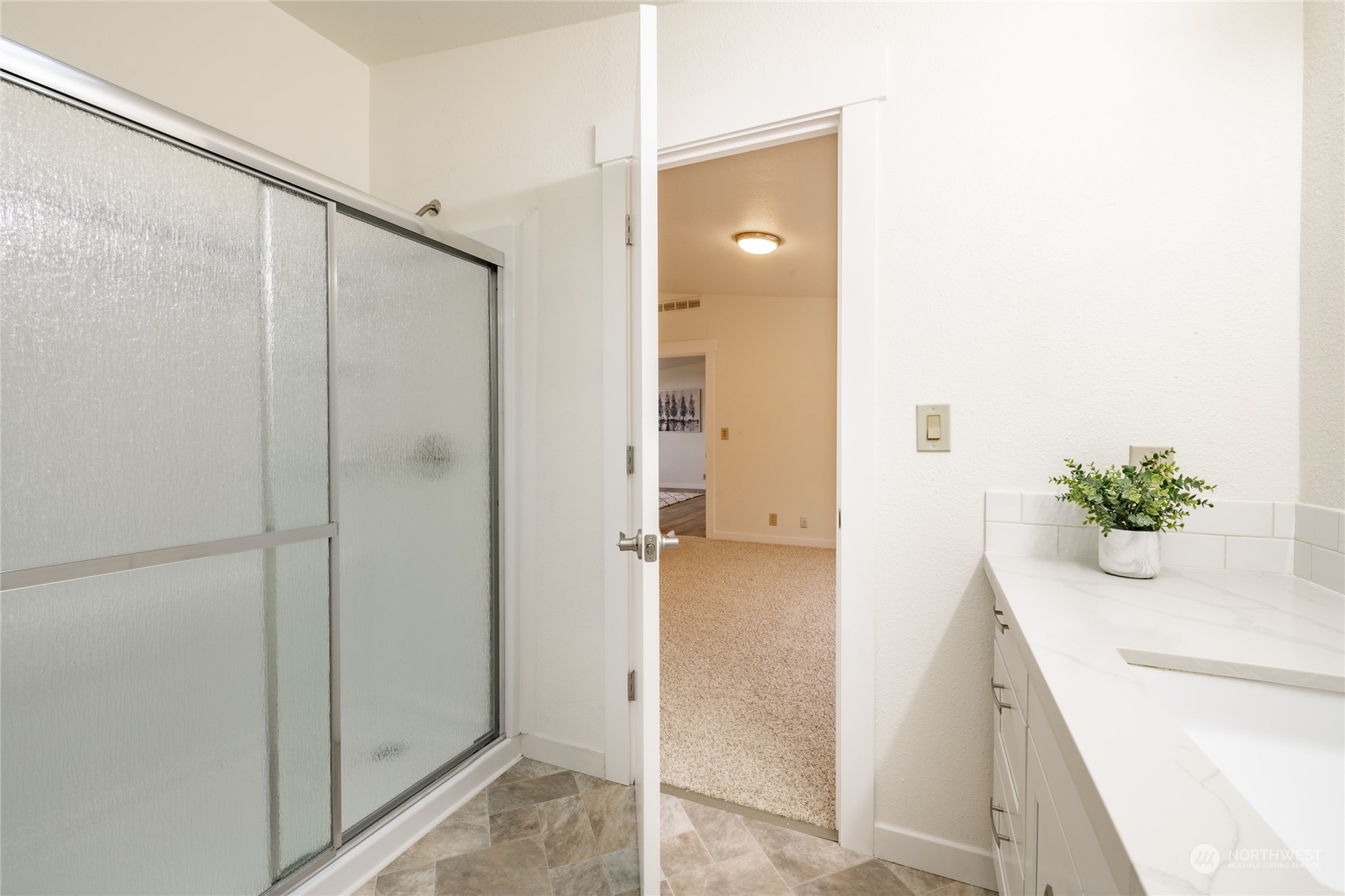 6671 Olson Road Ferndale, WA 98248 - Photo 21 of 40 a view of a bathroom with a glass door shower