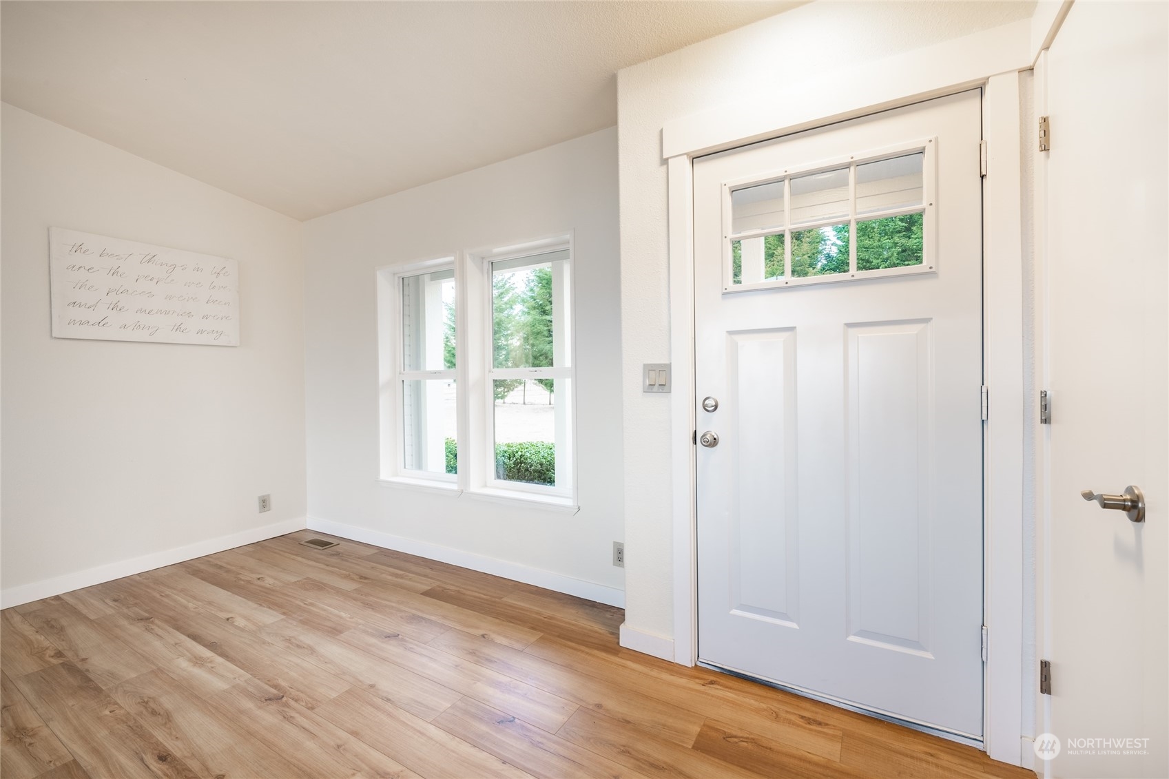 6671 Olson Road Ferndale, WA 98248 - Photo 23 of 40 an empty room with wooden floor and windows