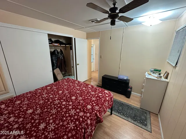 a bedroom with a bed and a walk in closet
