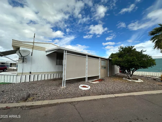 a backyard of a house with a yard and garage
