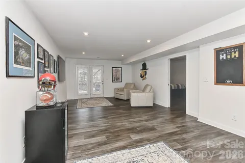 a spacious bedroom with a bed and furniture