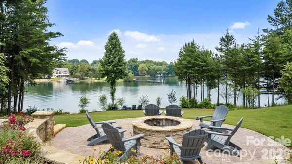 a view of a patio with swimming pool and furniture