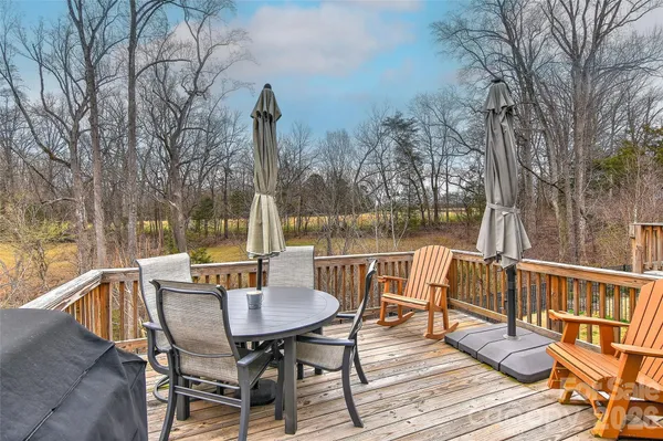 a view of a chairs and table on the deck
