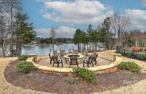 a view of a lake with outdoor seating