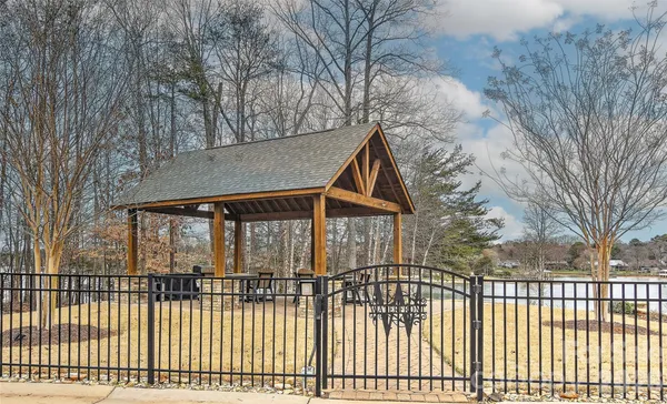 a front view of a house with a fence