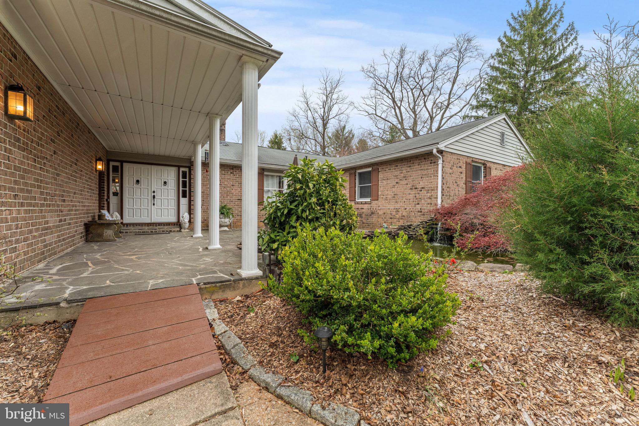 8 Manor Brook Road Monkton, MD 21111 - Photo 1 of 62 a front view of a house with garden