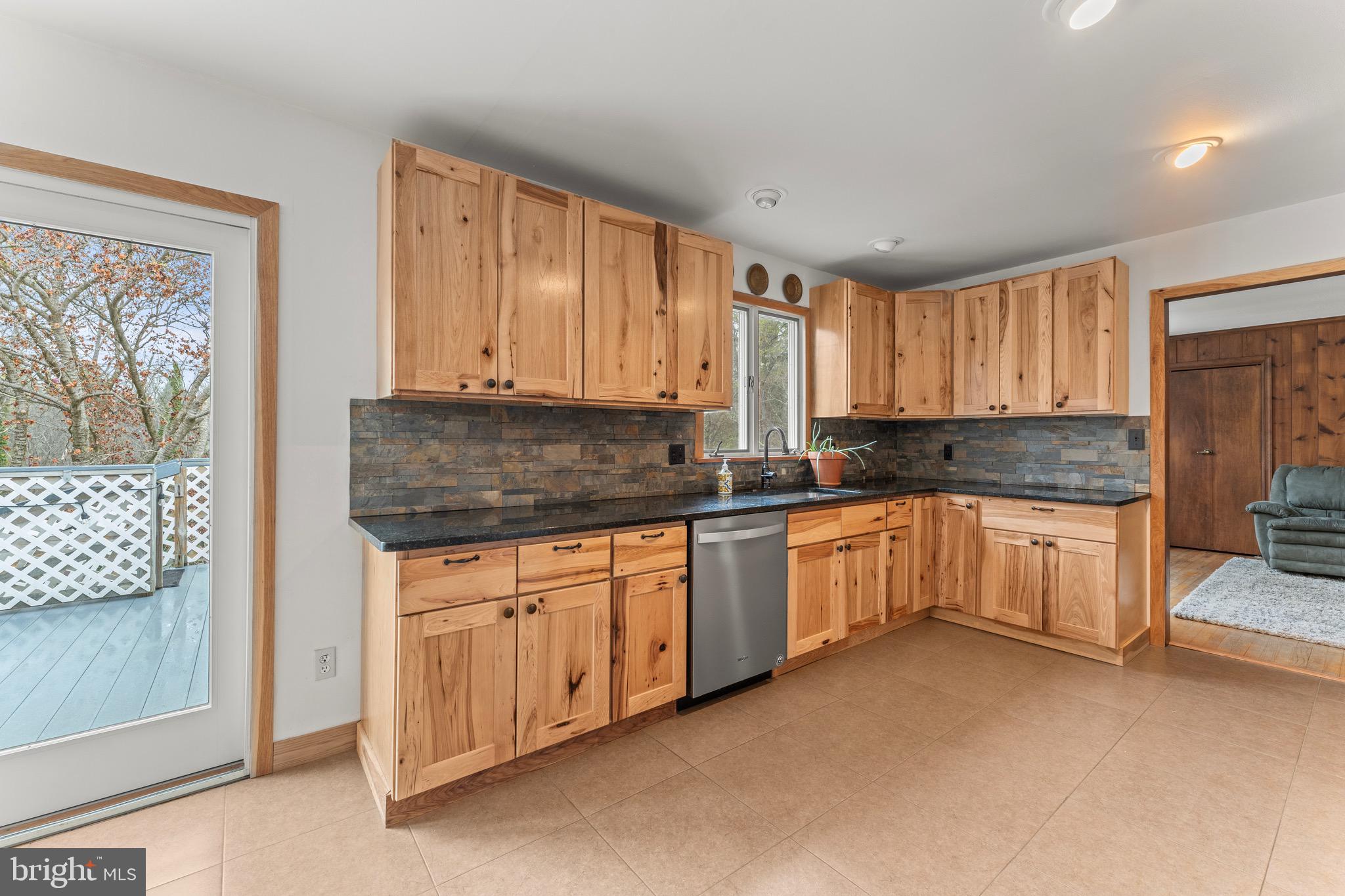 8 Manor Brook Road Monkton, MD 21111 - Photo 15 of 62 a kitchen with granite countertop a stove a sink and a granite counter tops