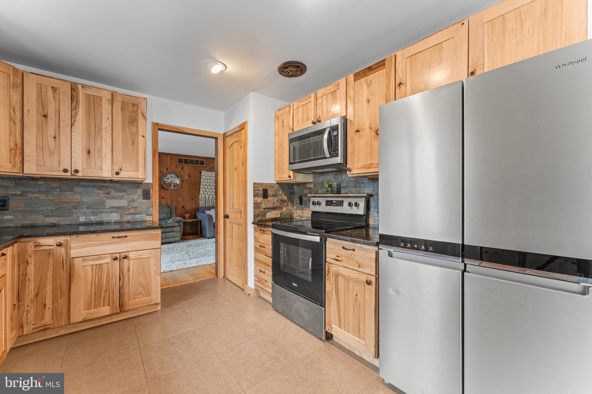 8 Manor Brook Road Monkton, MD 21111 - Photo 16 of 62 a kitchen with stainless steel appliances a refrigerator sink and microwave