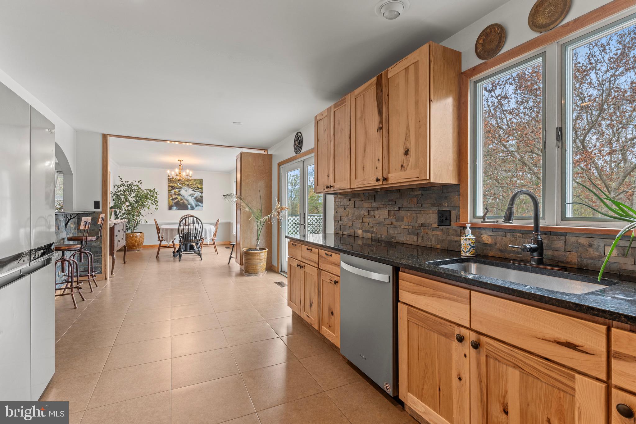 8 Manor Brook Road Monkton, MD 21111 - Photo 17 of 62 a kitchen with stainless steel appliances granite countertop a stove a sink and a granite counter tops with white cabinets