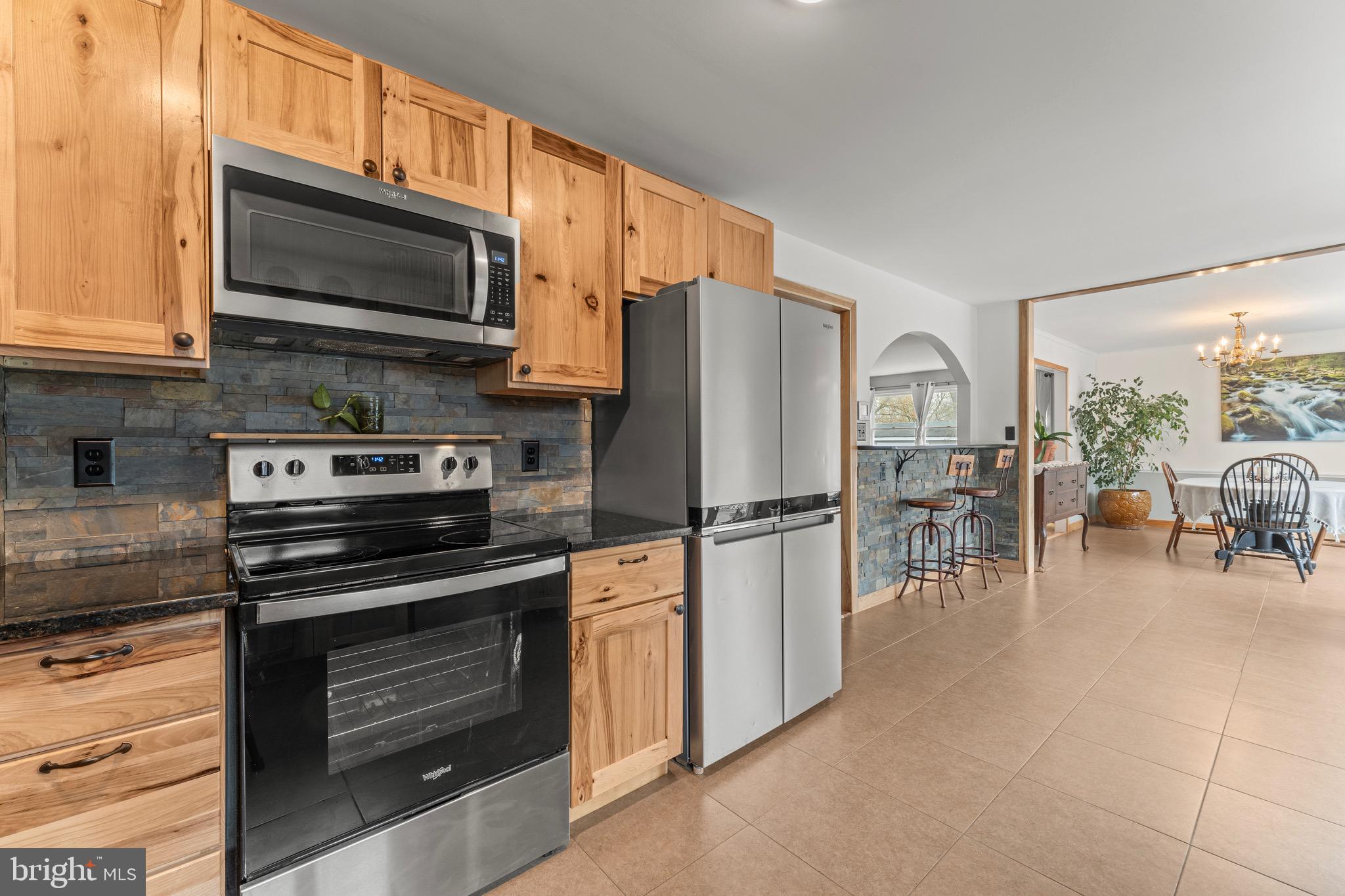 8 Manor Brook Road Monkton, MD 21111 - Photo 18 of 62 a kitchen with stainless steel appliances a stove a microwave and a refrigerator