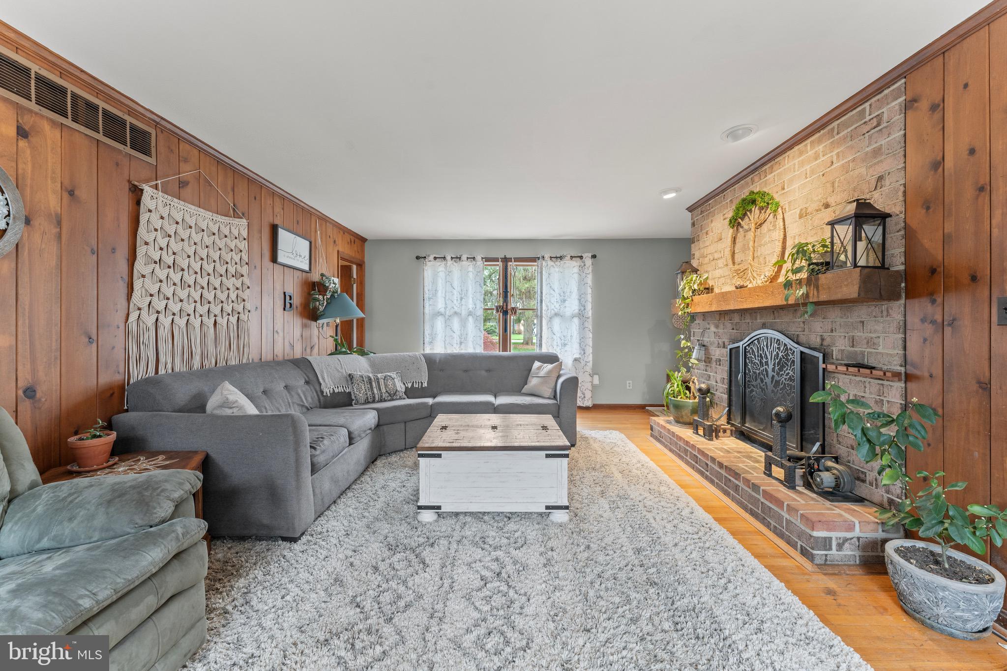8 Manor Brook Road Monkton, MD 21111 - Photo 23 of 62 a living room with furniture a fireplace and a flat screen tv