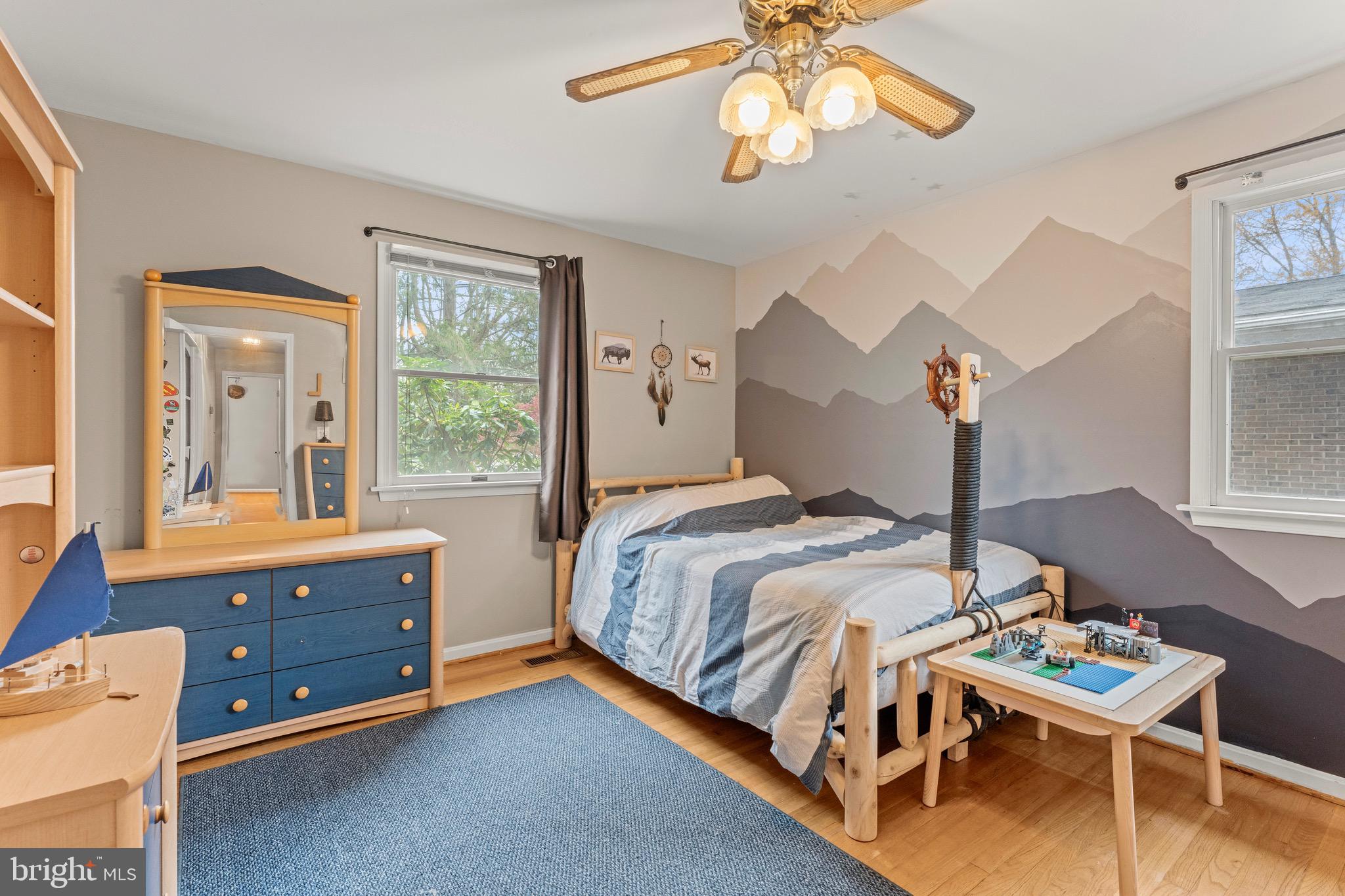 8 Manor Brook Road Monkton, MD 21111 - Photo 33 of 62 a bedroom with a bed and a chandelier