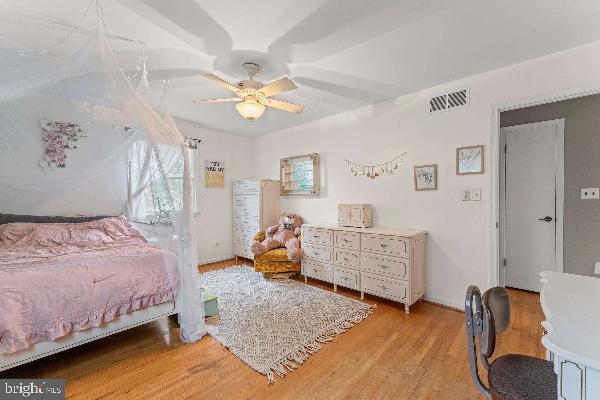8 Manor Brook Road Monkton, MD 21111 - Photo 36 of 62 a bedroom with a bed and wooden floor