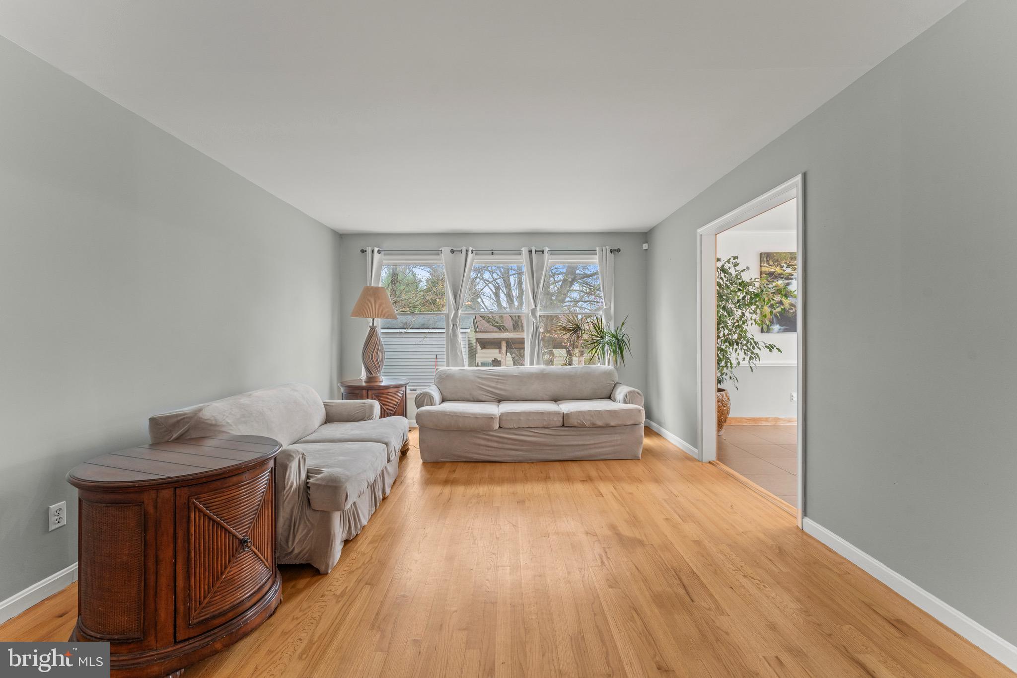 8 Manor Brook Road Monkton, MD 21111 - Photo 5 of 62 a spacious bedroom with a bed and wooden floor