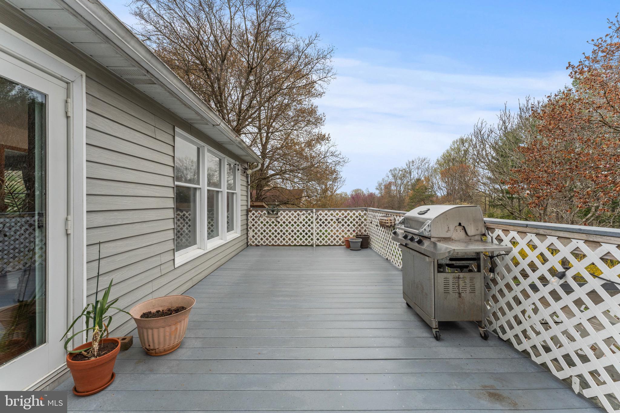 8 Manor Brook Road Monkton, MD 21111 - Photo 54 of 62 a terrace with outdoor seating and wooden fence