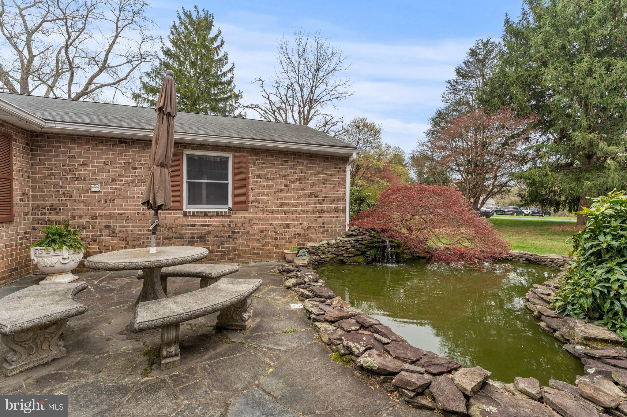 8 Manor Brook Road Monkton, MD 21111 - Photo 59 of 62 a view of a patio with table and chairs couches with wooden floor and fence