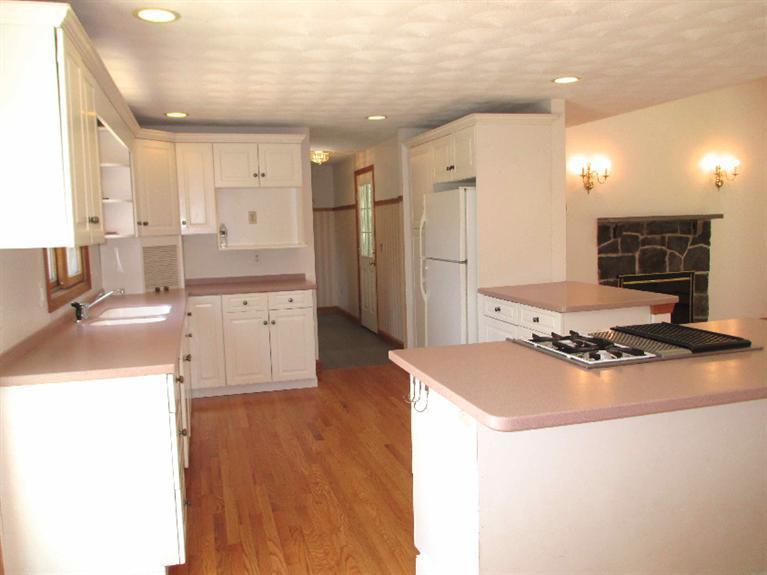 350 Training Field Road Chatham, MA 02633 - Photo 12 of 33 a kitchen with stainless steel appliances granite countertop a sink stove and refrigerator