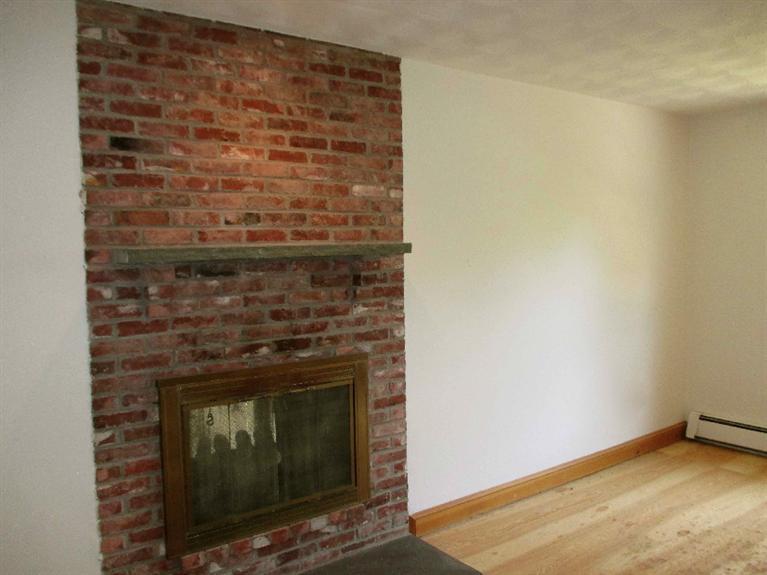 350 Training Field Road Chatham, MA 02633 - Photo 20 of 33 a living room with a fireplace